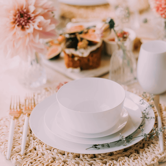 Elegant winter wonderland table setting with sparkling centerpieces and gold accents.