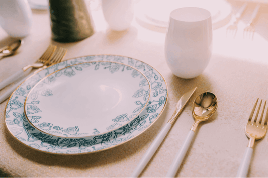 Close-up of Yom Tov Settings dinner plates on a festively decorated table